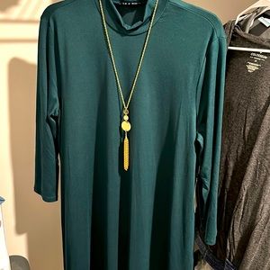 Forest green dress with gold necklace